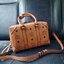 M.C.M SMALL E/W SOFT BERLIN CROSSBODY IN VISETOS ไอเท็มใหม่ในดีไซน์ทรงกระเป๋าเดินทางแบบคลาสสิค ย่อส่วนมาให้ใช้งานได้แบบสบายๆ พกพาสะดวก แมทช์ได้ทุกสไตล์ ใช้ได้แบบ unisex ใช้งานง่ายด้วยหูจับในตัว และซิปหลัก อะไหล่สีดำดูมีมิติตัดกับสีน้ำตาลคอนยัคได้เป็นอย่าง