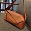 LOEWE PUZZLE HOBO BAG ใหม่ล่าสุด กับแบรนด์ที่มีดีไซน์โดดเด่นเป็นเอกลักษณ์ สวยหรูทุกรุ่นจริงๆ!! กระเป๋าสะพายโฮโบ ทรงสวย สไตล์พัซเซิลคลาสสิค วัสดุหนังวัวฟอกสี นิ่มมือ ฟินมาก!! เปิดใช้งานด้วยซิป ที่ภายในโล่งกว้าง ใส่ของสำคัญได้ครบไม่มีพลาด แบบสบายๆ มาพร้อมสา