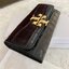 TORY BURCH Croc Long Wallet กระเป๋าสตางค์ใบยาว วัสดุหนังแกะสังเคราะห์ อะไหล่อทองโดดเด่นที่ด้านหน้า หนังเงาขึ้นรูปสวย เปิด-ปิดด้วยกระดุม ด้านในกระเป๋าแบ่งออกเป็นPatation มีช่องชิปยาวตรงกลาง มีช่องสำหรับ 6 ใบ งานสวยพร้อมส่งให้รับทรัพย์กันแล้ววันนี้