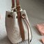 MIU MIU Canvas and leather bucket bag / MIU MIU Bucket Bag กระเป๋าทรงบัคเก็ต ผ้าแคนวาสอย่างดีตกแต่งโลโก้เพิ่มสัมผัสอันเป็นเอกลักษณ์