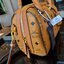 M.C.M ESSENTIAL BOSTON BAG IN VISETOS กระเป๋าถือ/สะพายข้าง ทรงหมอน สวยโดดเด่น ทรงสวยยอดนิยม มาพร้อมพวงหนังห้อย และสายรัดเก็บหูจับ วัสดุหนังแคนวาสคุณภาพดี เปิด-ปิดด้วยซิป ภายในเป็นหนังกลับ โล่งกว้าง ใส่ของได้เยอะ กระเป๋าสตางค์ โทรศัพท์ ของจุกจิกต่างๆ สบาย!