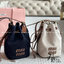 MIU MIU Canvas and leather bucket bag / MIU MIU Bucket Bag กระเป๋าทรงบัคเก็ต ผ้าแคนวาสอย่างดีตกแต่งโลโก้เพิ่มสัมผัสอันเป็นเอกลักษณ์