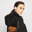 M.C.M MEDIUM MILLIE CROSSBODY IN VISETOS LEATHER BLOCK กระเป๋าสะพายกึ่งคลัทช์ ไซส์ medium กำลังสวย ดีไซน์ใหม่ เพิ่มขอบหนังสีดำ ให้ดูมีมิติ น่าใช้มากยิ่งขึ้น