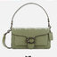 COACH TABBY SHOULDER BAG 26 ((73995)) พัฒนามากจากกระเป๋า Coach รุ่นดังยุค 1970 ทำจากผ้า Canvas เคลือบลายซิกเนเจอร์ หนังลายกรวดและหนังกลับ ด้วยวัสดุคลาสสิค มากับสายที่ถอดได้ถึง 2 สาย ไม่ว่าจะเป็นสายหิ้วหรือสายสะพาย หนังลายกรวดและหนังลูกวัวแบบเนื้อละเอียด แ