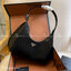 PRADA LEATHER HANDBAG ขนาดกะทัดรัด พกพาสะดวก Everyday look อะไหล่เงิน หนังเงาหนาอยู่ทรงสวย ด้านหน้ามีโลโก้แบรนด์ เปิดปิดด้วยซิป อะไหล่เงิน