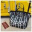 Gucci Embroidered large canvas tote bag Variation multicolor canvas กระเป๋าสะพายทรงโท้ทใบใหญ่ โดดเด่นผ้าแคนวาสฝ้ายลายทางสะดุดตา ตกแต่งด้วยงานปักลาย Gucci ด้านหน้า คอลเลคชั่นฤดูใบไม้ผลิ/ฤดูร้อน 2025