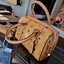 M.C.M ESSENTIAL BOSTON BAG IN VISETOS กระเป๋าถือ/สะพายข้าง ทรงหมอน สวยโดดเด่น ทรงสวยยอดนิยม มาพร้อมพวงหนังห้อย และสายรัดเก็บหูจับ วัสดุหนังแคนวาสคุณภาพดี เปิด-ปิดด้วยซิป ภายในเป็นหนังกลับ โล่งกว้าง ใส่ของได้เยอะ กระเป๋าสตางค์ โทรศัพท์ ของจุกจิกต่างๆ สบาย!