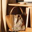 Tory T Monogram Mcgraw Dragonfly กระเป๋าถือหรือสะพายไหล่ วัสดุหนัง Jacquard อะไหล่ทอง ทรงปีก เปิด-ปิด ด้วยกระดุมแม่เหล็ก ด้านในโลง มี 2ช่องเล็ก จุของได้เยอะ น้ำหนักเบา สายสะพาย crossbody ได้ ปรับระดับได้