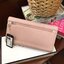 GUESS FACTORY WOMEN'S LONG WALLET กระเป๋าสตางค์ทรงยาวแบบสามพับ วัสดุหนังลายsaffiano เปิดปิดด้วยกระดุมสะดวกใช้ ภายในมีทั้งช่องซิปใส่เหรียญ ช่องใส่ธนบัตรและช่องใส่บัตรหลายช่องและช่องใส่รูปแยกเป็นสัดส่วน ด้านหน้ามีโลโก้แบรนด์ทรงสามเหลี่ยม ด้านหลังมี1ช่อ