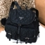PRADA NYLON BACKPACK WITH POCKET กระเป๋าเป้ premiumbgift จากเคาน์เตอร์แบรน วัสดุ Nylon เนื้อหนา ลายตาราง คุณภาพดี ด้านหน้า มีโลโก้แบรนด์ อะไหล่เงิน มี Pocket หน้า 2 ช่อง หัวซิป และอะไหล่ปั๊มแบรนด์ พร้อมพวงกุญแจปอมสีดำ ถอดเเยกใช้ได้ค่ะ เปิดปิดด้วยฝาปิด Dra