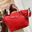 Longchamp LE PLIAGE CUIR TOP HANDLE BAG S เรียกว่าเป็นกระเป๋าอีกหนึ่งรุ่นที่ไม่ว่ายังไงก็ฮอตฮิตและติดเทรนด์ตลอดไม่เคยเปลี่ยนกับ ทรง Le Pliage Cuir หนึ่งในตระกูลกระเป๋าสุดไอคอนิกจากแบรนด์ เมื่อรุ่น Le Pliage Cuir ในรูปแบบของหนังแกะ Metis ได้ถือกำเนิดขึ้นใน