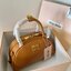 MIU MIU HALF-MOON TOP HANDLE BAG / Patent leather bowling bag / Miu Miu Leather top-handle bag กระเป๋าทรงพระจันทร์เสี้ยว หนังนิ่ม ลื่นเงา ตัดกับอะไหล่ทองได้ลงตัว
