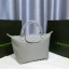 Longchamp Size S สินค้าใหม่ ของแท้!! เป็นล็อตผลิตเกินออเดอร์จากโรงงาน มาพร้อมการ์ด/ถุงผ้าแบรนด์/ถุงกระดาษแบรนด์ Size S: 25 x H. 23 x 16 cm. Color: Dusty Grey 274