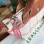LONGCHAMP LE PLIAGE TORCHON Top handle bag - Red กระเป๋าถือขนาดเล็ก วัสดุผ้าฝ้าย อะไหลเงิน ตัดแต่งด้วยหนังวัวแท้ ผสมผสานแนวคลาสสิกแบบมินิมอลศิลปะการพับกระดาษแบบญี่ปุ่นดั้งเดิม